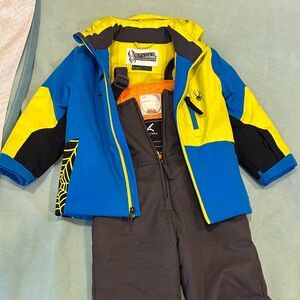 Bundle Spyder Blue and Yellow Ski Jacket with Arctix Grey Bib Pants